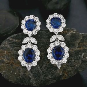 Sterling Silver Flower Earrings with Sapphire CZ Posts